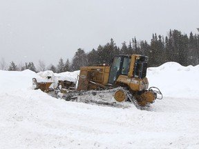 A dozer was brought in Wednesday to do some preliminary clearing of snow at the snowdump on Spruce Street South in preparation for the Triple Crown Pro Snowcross event being put on by the Canadian Snowcross Racing Association this Saturday and Sunday.

RON GRECH/The Daily Press