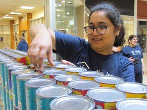 Disna Thomas, with a team from WorleyParsons, is shown in this file photo helping build an entry at the Canstruction competition in Sarnia.