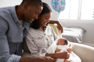 Couple holding their baby