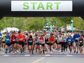 Runners in the Asics Runnerkeeper 10 KM race off the start line on Sunday, May 29, 2022.