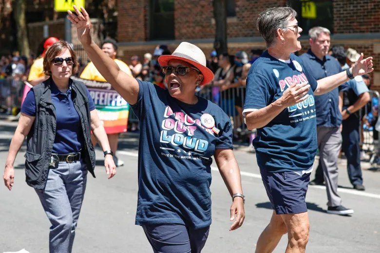 Chicago Mayor Lori Lightfoot (L) and Chicago's First Lady Amy Eshleman (R) attend the 51st LGBTQ Pride Parade in Chicago, Illinois, on June 26, 2022. - The Pride Parade returned to the Lakeview and Uptown neighborhoods after a three year hiatus due to the coronavirus pandemic.