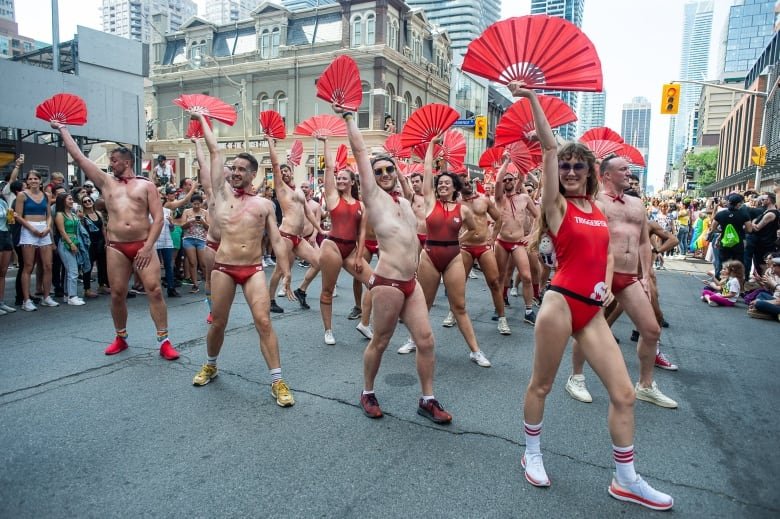 People march in the Pride parade marking the return of in-person festivities for the annual LGBTQ celebration, in Toronto, Sunday, June 26, 2022. THE CANADIAN PRESS/Eduardo Lima