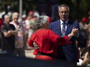 Saskatchewan Lt.-Gov. Russ Mirasty dances with wife Donna Mirasty during Canada Day celebrations at the Government House grounds on July 1, 2022 in Regina.