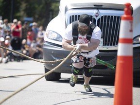 Eric Paul competes during the Classic Strongman Championship League competition during Canada Day celebrations at Wascana Park on July 1, 2022 in Regina.