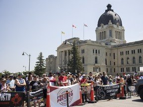 Spectators watch the Classic Strongman Championship League competition during Canada Day celebrations at Wascana Park on Friday, July 1, 2022 in Regina.