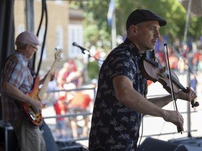 Fiddler Karrnnel Sawitsky performs on stage during Canada Day celebrations at the Government House grounds on July 1, 2022 in Regina.