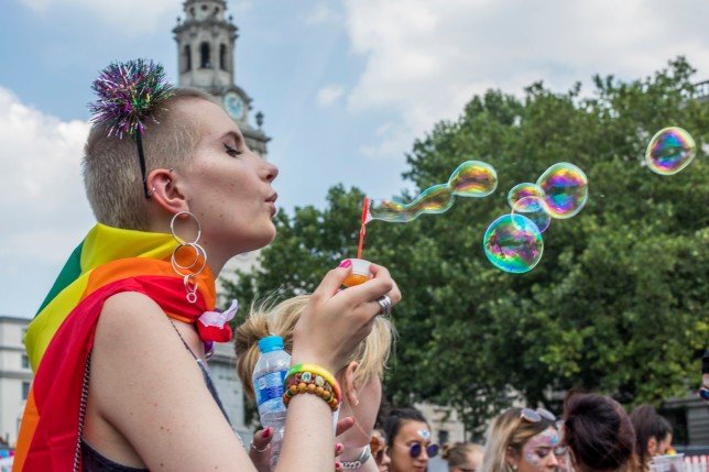 Hundreds of thousands of people have crowded in the streets of central London for the citys annual LGBT Pride celebration, in London, United Kingdom, on July 7, 2018. In the picture: people having fun during the Pride. (Photo by Mauro Ujetto/NurPhoto via Getty Images)