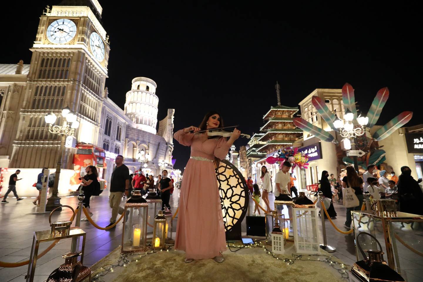 A violinist performs at the entrance of Global Village. Photo: Chris Whiteoak / The National